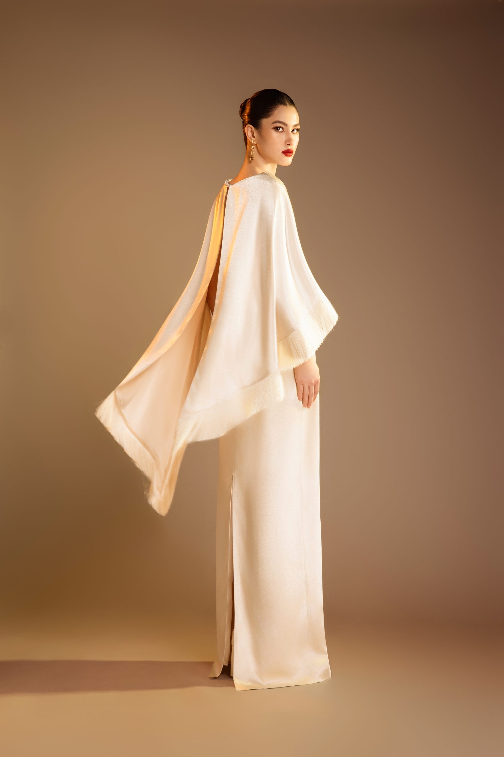 Column Gown With Fringed Trim Cape